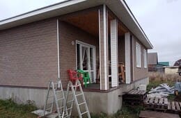 Фасад с панорамным окном и террасой